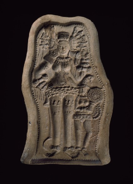 Mould for a plaque with a bejewelled goddess or yakshi (nature spirit) with female attendantfront