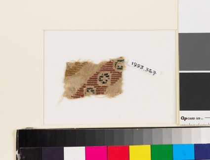 Textile fragment with diagonal band of rosettes in squaresfront