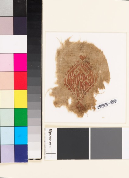 Textile fragment with diamond-shaped medallion and pseudo-kufic inscriptionfront