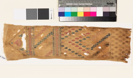 Textile fragment with geometric shapes and a diamond-shaped medallionfront