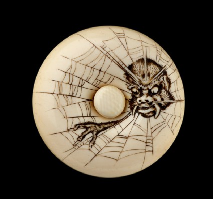 Manjū netsuke depicting the Earth Spider in a webfront