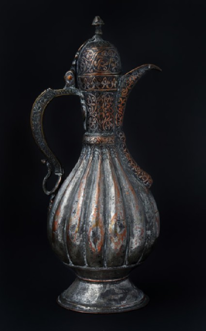 Ewer with scalloped body and engraved decorationfront