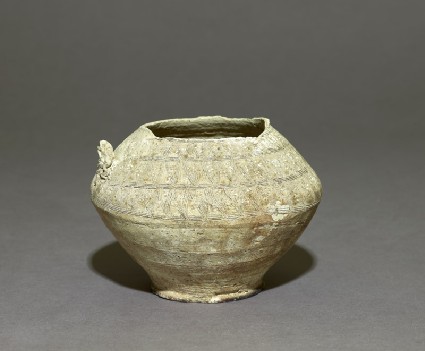 Earthenware pot with incised decorationoblique