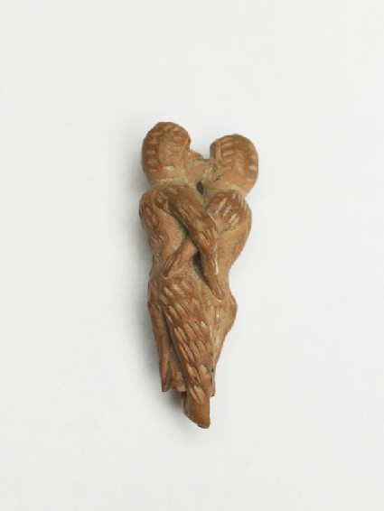 Terracotta figure of monkeys embracingoblique