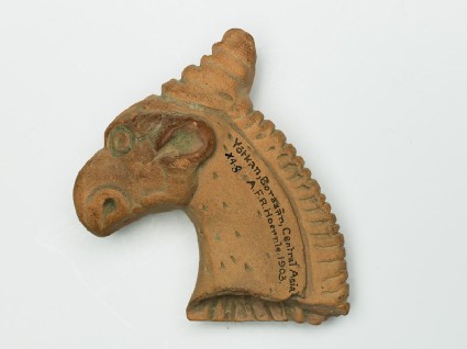 Head of a griffin from a vase handlefront