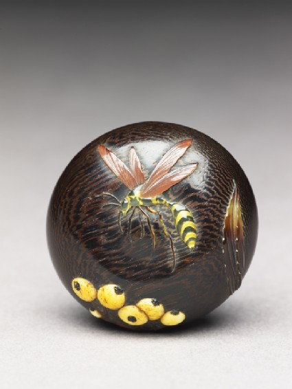 Manjū netsuke with wasp and berriesfront