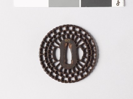 Round tsuba with radiating floral designfront