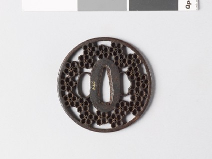 Round tsuba with plum and cherry blossomsfront
