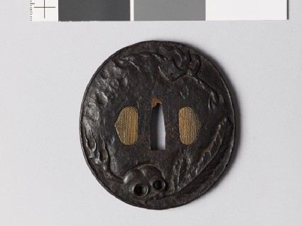 Tsuba with skull and New Year decorationsfront