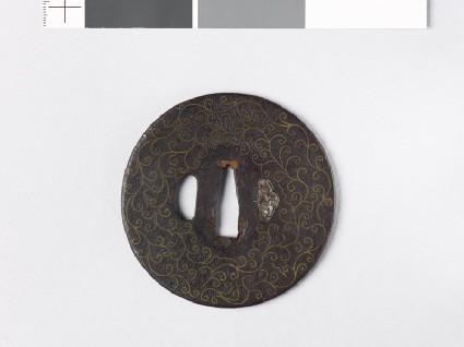Round tsuba with scrolls and karigane, or flying geesefront