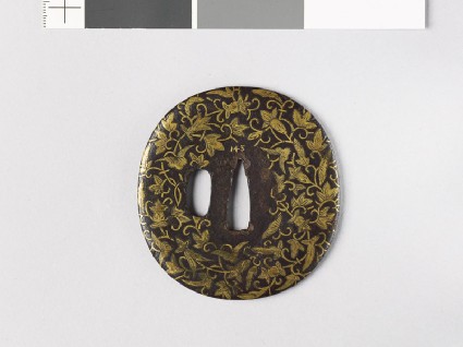 Lenticular tsuba with leaves and flowersfront
