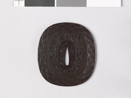 Tsuba with waves and cherry blossomsfront