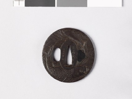 Tsuba with carp leaping from turbulent waterfront