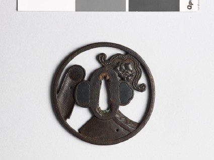 Tsuba with roof tiles depicting a demon mask and chrysanthemumfront