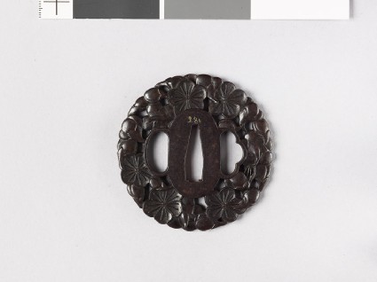 Round tsuba with plum blossomsfront