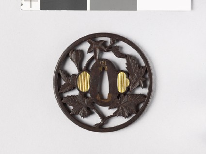 Round tsuba with flowering branchfront