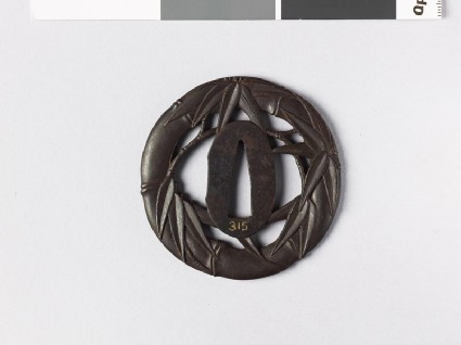 Round tsuba with bamboo branch and leavesfront