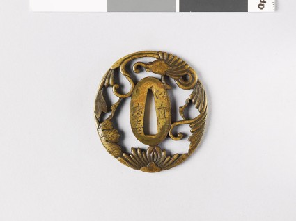 Tsuba with amariō, or rain dragon, formed from leaves and scrollsfront