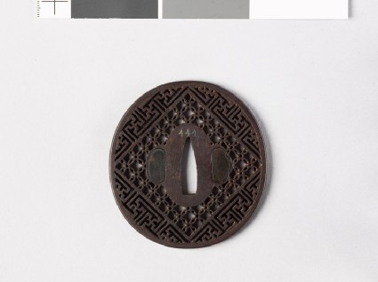 Tsuba with diaper formed from interlaced circles and swastikasfront