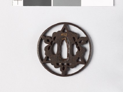 Round tsuba with triangle and flowersfront