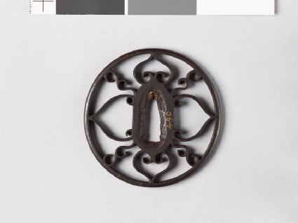 Round tsuba with scrolls and aoi, or hollyhock leavesfront