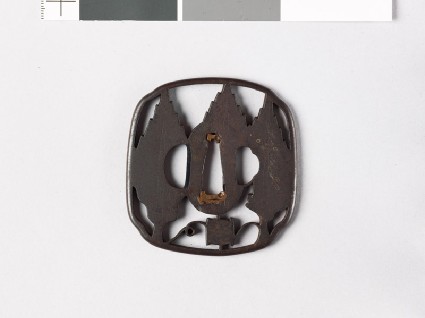 Aori-shaped tsuba with cryptomeria trees and silk reelfront