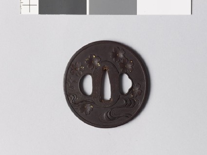 Tsuba with cherry blossoms falling towards a streamfront