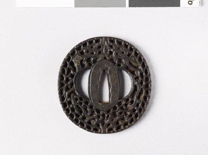 Tsuba with dragons amid scrollworkfront