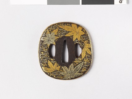 Aori-shaped tsuba with maple leaves on waterfront