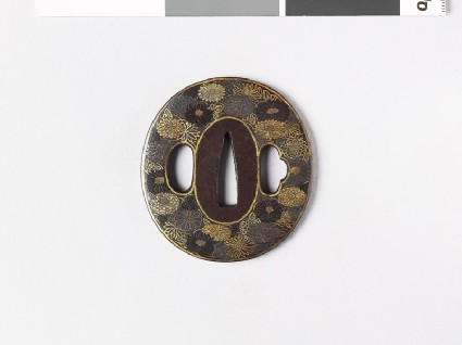 Lenticular tsuba with chrysanthemum flowersfront