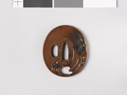 Tsuba depicting a monkey hiding from an eaglefront