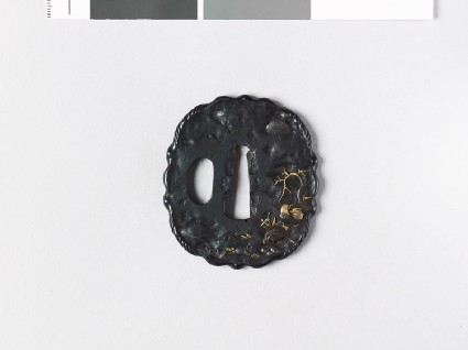 Tsuba depicting a drake and duck by a frozen poolfront