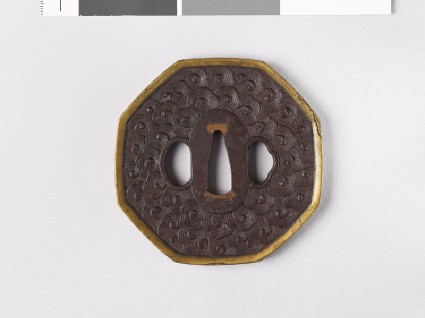 Octagonal tsuba with clouds and dragonsfront
