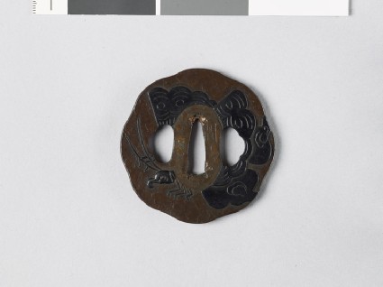 Tsuba with butterfly and mon made from kiri, or paulownia leavesfront