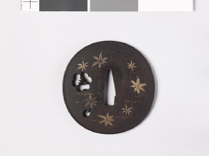 Lenticular tsuba with petals and leavesfront