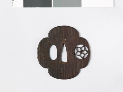 Mokkō-shaped tsuba with mon formed of a clematis flower in a circlefront