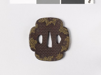 Mokkō-shaped tsuba with clematis flowers and karakusa, or scrolling plant patternfront