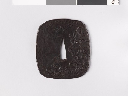 Tsuba depicting Bashikō about to perform acupuncture on a dragonfront