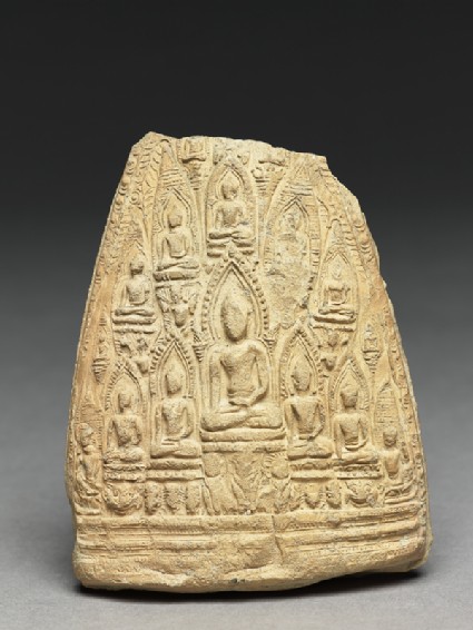Votive plaque of the seated Buddha with attendant Buddhasfront