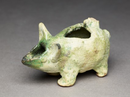 Oil lamp in the form of a pigletoblique
