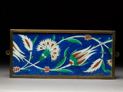 Rectangular tile with scroll of tulips and carnationstop