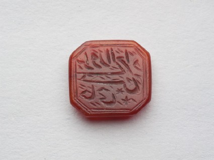 Octagonal bezel seal with nasta‘liq inscription, chevron decoration, and a starfront