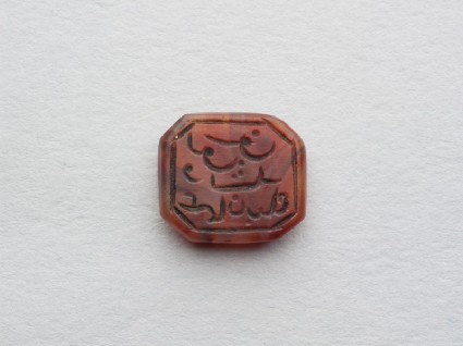 Octagonal bezel seal with naskhi inscription and linear decorationfront