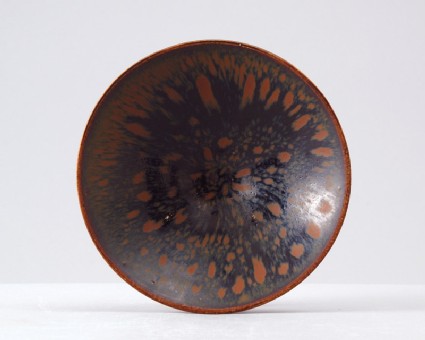 Black ware tea bowl with 'partidge feather' glazestop