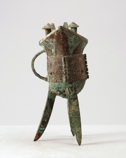 Ritual tripod wine vessel, or jue, with taotie mask patternfront