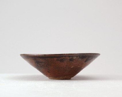 Black ware tea bowl with prunus under a crescent moonfront