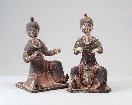 Figure of a seated female attendantfront
