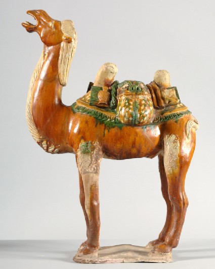 Figure of a camel with saddle in the form of an animal maskfront