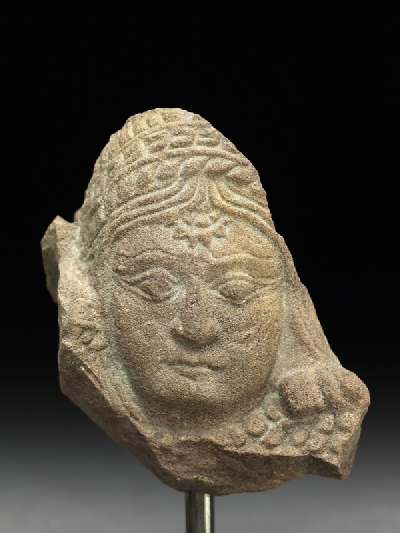 Female head with sun and moon