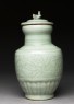 Greenware funerary vase with flowers and a bird (side)
